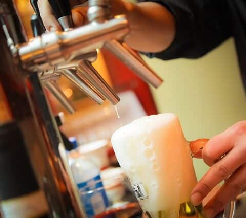 bartender pouring a beer at bar near apartment in wilmington de