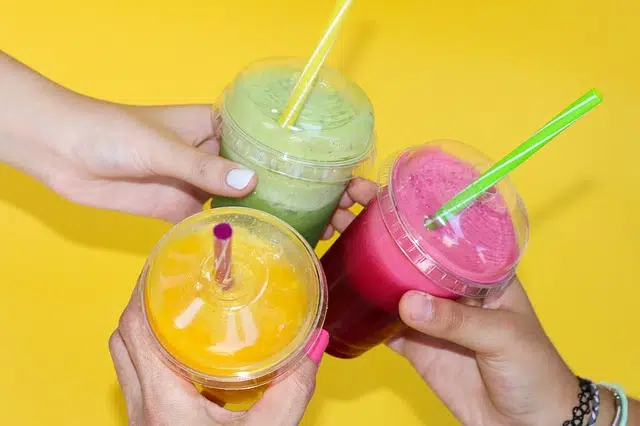 friends drinking smoothies near apartment in wilmington de