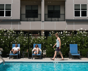 people lounge by pool at apartments in wilmington de